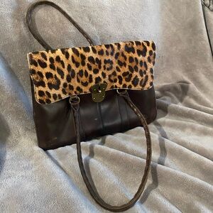 Fossil leather satchel with leopard design